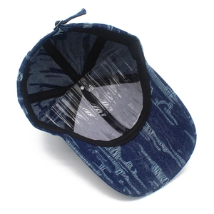 Deep blue denim baseball cap with distressed details and structured vintage street style