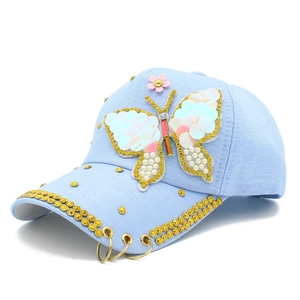 Light blue baseball cap for girls featuring a sequined butterfly and rhinestone brim