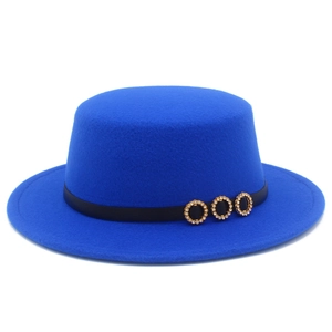 Detail of blue flat top wool fedora with black ribbon and sparkling gold buckles