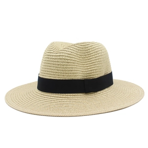 Detailed close-up of the woven texture and black ribbon on the classic straw sun hat