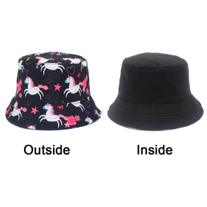 Detailed view showing both sides of a reversible kids sun hat with unicorn prints