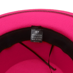 Detail of fuchsia polyester fedora hat inner lining with size 57 label and sweatband
