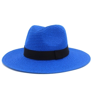 Close-up of royal blue woven sun hat featuring a classic black ribbon band decoration