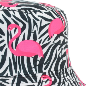 Close-up of pink flamingo and tropical leaf print on cotton bucket hat fabric