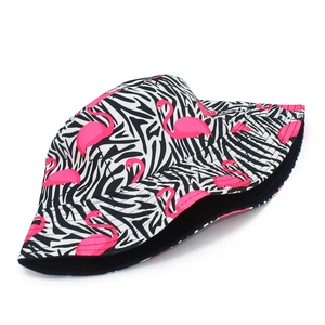 Detail view of pink flamingo print on zebra striped canvas sun hat for women