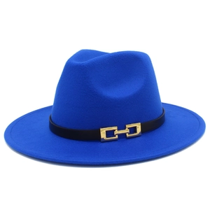 Macro shot of a blue wool fedora hat featuring a black leather band and gold metal buckle