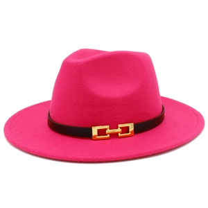 Close-up of pink wool fedora hat with black leather band and gold metal buckle detail