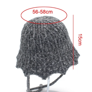Detailed knit texture of dark grey bucket hat with ear flaps and ties, 56-58cm fit