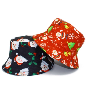 Detail of red and black Christmas bucket hats with festive Santa and snowman patterns