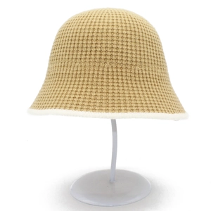 Detail of waffle knit texture and contrast edge on the khaki knitted cloche bucket hat