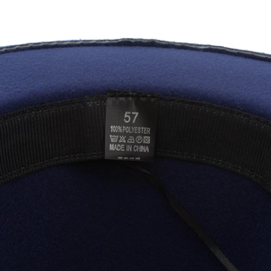 Detailed macro view of the interior sweatband and size label of a wool-feel jazz hat