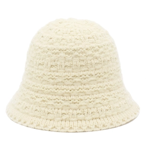 Close-up of thick knit cream bucket hat showing detailed 3D woven texture and warm yarn