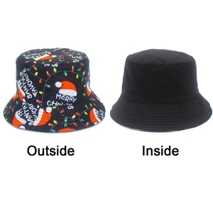 Detailed view of the double-sided Christmas bucket hat showing holiday prints and solid lining