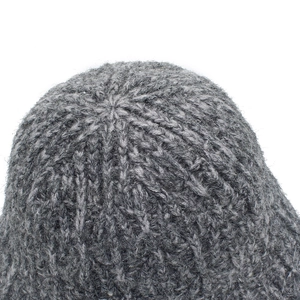 Macro shot of the knitted crown and seamless top stitching of the gray bucket hat