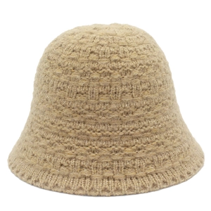 Detail of beige knitted bucket hat with textured thick wool and gold thread weaving