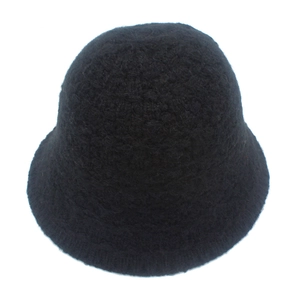 Detail shot of black knitted bucket hat showing rich wool-like grainy texture and soft material