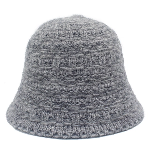 Grey knitted bucket hat with plush texture and stylish ribbed pattern for autumn and winter
