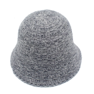 Detailed close-up of grey knitted bucket hat showing ribbed texture and wool blend fabric