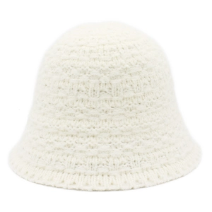 Close-up of white knitted bucket hat with detailed checkered pattern and ribbed edge