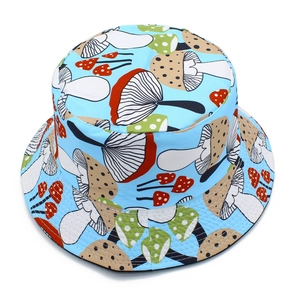 Top view of a sky blue bucket hat with colorful cartoon mushroom patterns for sun protection