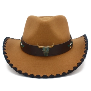 Detailed close-up of brown western cowboy hat with longhorn skull belt and black stitching