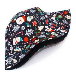 Detailed view of black festive bucket hat featuring vibrant Santa and snowman patterns