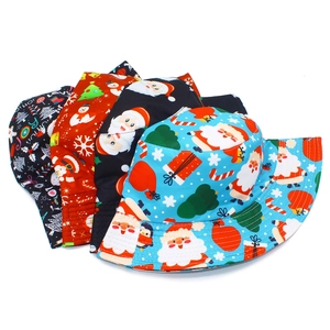Set of four cotton bucket hats with colorful Christmas Santa and snowman festive prints