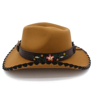 Detailed embroidery and vintage metal buckle on the brown western cowboy hat band
