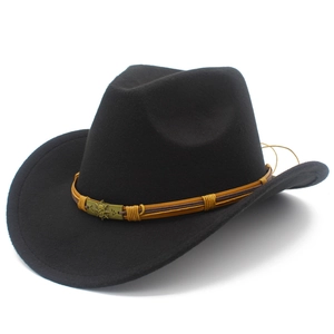 Detail of black wool felt cowboy hat featuring woven band and antique bronze skull buckle