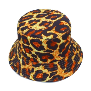 Close-up of leopard print bucket hat with stitched brim and orange-brown pattern