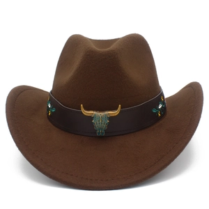 Close-up of bronze bull head ornament and floral embroidery on brown felt cowboy hat