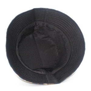Detail of the multi-row reinforced stitching on the black fisherman hat's inner brim