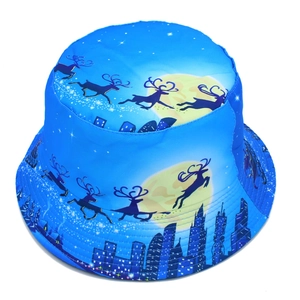 Blue reversible bucket hat featuring festive reindeer and moonlight city print