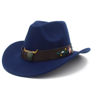 Detail of navy western cowboy hat featuring bull skull ornament and floral embroidery