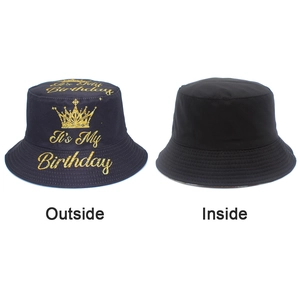 Detail view of the black cotton bucket hat showing the birthday crown print and inside lining