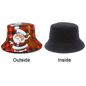 Dual-sided bucket hat with red buffalo plaid Christmas pattern and solid black inner layer