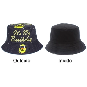 Detail of reversible black bucket hat with cartoon duck and It's My Birthday print