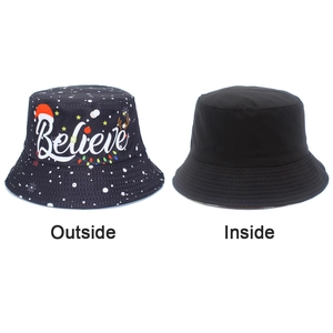 Detail view of double-sided Christmas bucket hat featuring festive patterns and black lining