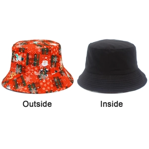 Detail view of reversible sun hat showing Santa Claus print and plain black interior