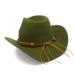Detail view of olive green wool jazz hat with brown leather strap and side bow decoration