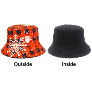 Dual-sided bucket hat detail showing red buffalo plaid exterior and solid black interior