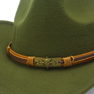 Detail of dark green fedora featuring a leather belt with skull metal emblem