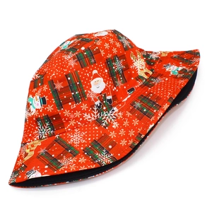 Christmas bucket hat featuring Santa, snowman, and reindeer prints on red plaid fabric