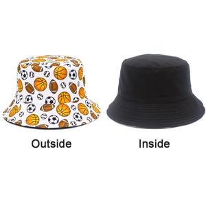 Reversible bucket hat with cartoon sports ball prints and a solid black inner lining