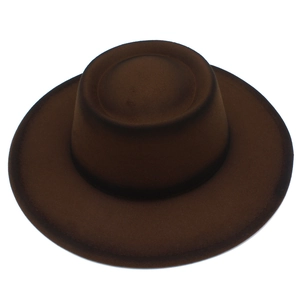 Top-down view of a classic brown wool felt fedora showing smooth texture and round crown
