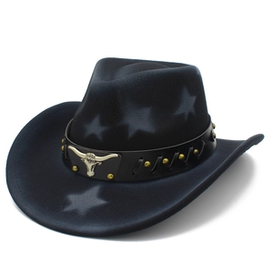 Detail of western cowboy hat featuring vintage bull head emblem and rivet leather band