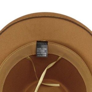 Detail view of western cowboy hat interior showing sweatband and 65% cotton material