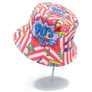 Pink 90S bucket hat with retro pop art prints and bold stripes on a display stand