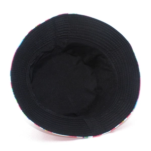Pink reversible bucket hat with cartoon print and black inner layer for sun protection