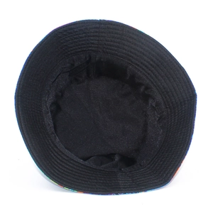 Black reversible bucket hat with interior stitching details and colorful patterned edge